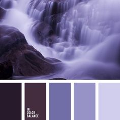 there is a waterfall in the water with rocks on it and purple hues are used to create this color scheme