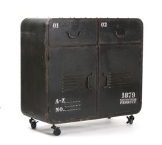 an old black metal cabinet on wheels with numbers and measurements written on the front, sitting against a white background