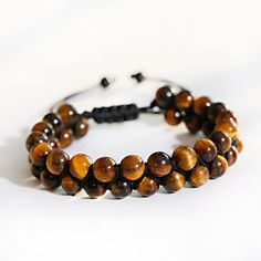 Casual Brown Beaded Braided Bracelets, Hand-wrapped Brown Friendship Bracelets, Hand Wrapped Brown Bracelets For Friendship, Casual Brown Bracelet Jewelry, Brown Hand-strung Friendship Bracelets As Gift, Spiritual Brown Bracelets With Wooden Beads, Spiritual Brown Friendship Bracelets, Adjustable Brown Wristband With 8mm Beads, Brown Hand-strung Beaded Bracelets For Meditation