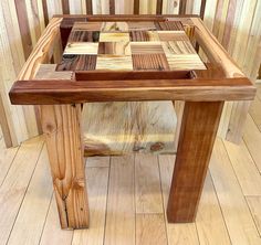 a table made out of wooden blocks on top of a hard wood flooring area