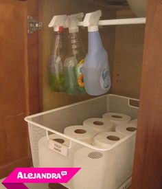 a tweep that is on top of a shelf with toilet paper and cleaning products in it