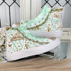 🌸 Step into your Sweet Sixteen or Quinceañera party with an air of elegance and panache, courtesy of our exquisite Flowers Style Custom Converse Shoes. These aren't your run-of-the-mill sneakers; they've undergone a regal transformation exclusively for your special birthday celebration. 🌸 Who says sneakers can't be both sophisticated and comfortable? Well, we're tossing that rulebook out the window! Our Converse shoes are tailor-made for dancing the night away without any foot-related concerns Quinceanera Shoes Sneakers, Quince Surprise Dance Outfits, Sweet 16 Shoes, Bedazzled Converse, Surprise Dance Outfits, Custom Converse Shoes, Quinceanera Shoes, Fifteenth Birthday, Quinceanera Themes Dresses