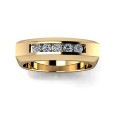 a yellow gold wedding ring with five diamonds