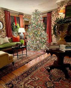 a living room with a christmas tree in the corner