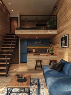 a living room filled with furniture and a stair case next to a wooden wall covered in wood planks