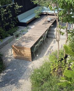 an outdoor seating area with benches and tables