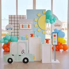 a room filled with balloons and decorations on the floor