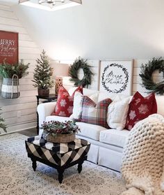 a living room filled with furniture and christmas decorations