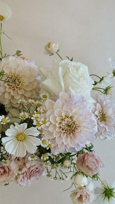 a bunch of flowers that are sitting on a table