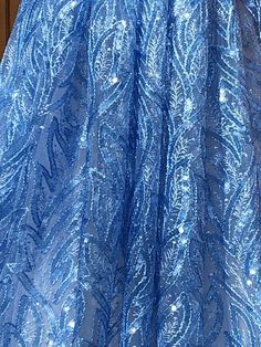 Beautiful Sequined lace. Very unique and sparkly! Width is 50”. Sold by the yard. Luxury Blue Embroidered Lace Fabric, Luxury Blue Sequin Fabric For Party, Spring Blue Embellished Sequin Fabric, Elegant Blue Sparkling Sequin Fabric, Embellished Blue Sequin Fabric For Prom, Blue Embellished Sequin Fabric For Prom, Fitted Blue Sequin Fabric With Glitter, Blue Fitted Sequin Fabric, Wedding Bridal Dress