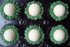 nine cupcakes with green and white frosting in a muffin tin on a table