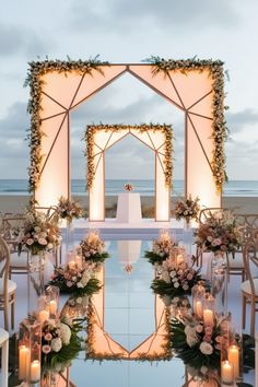 an outdoor ceremony setup with candles and flowers