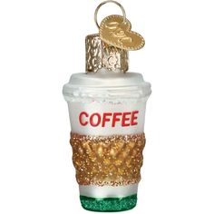 a coffee cup ornament with gold glitters and a keychain hanging from it