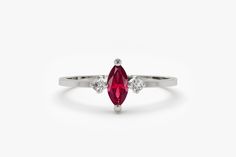 "14k Stackable Natural Ruby Ring / Marquise Ruby Ring and Diamond Ring / Dainty Ruby Ring / Minimal Genuine Ruby Ring / July Birthstone Ferkos Fine Jewelry Features ✔Made to Order ✔Gold Kt: 14K (also available in 18K) ✔Available Gold Color: Rose Gold, Yellow Gold, White Gold ✔Marquise Ruby: 1 pc 6x3MM ✔Round Diamond: 2 pc 1.75 MM ✔Number of Stones: 3 ✔Ruby CTW: 0.27 ctw ✔Diamond CTW: 0.05 ctw ✔Ready to Ship in 7-10 Business Days If you have any additional questions about this ring, just hit the Fine Jewelry Marquise Ruby Ring With Accent Stones, Fine Jewelry Ruby Ring With Marquise Accent Stones, Marquise Ruby Ring With Accent Stones, Marquise Ruby Ring For Promise, Fine Jewelry, Marquise Ruby Ring With Accent Stones For Promise, Marquise Ruby Ring In White Gold, Marquise White Gold Ruby Ring, White Gold Marquise Ruby Ring, Marquise Birthstone Ring In Fine Jewelry Style