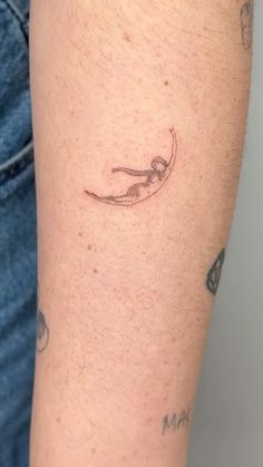 a person with a tattoo on their arm