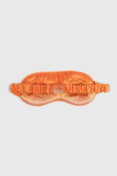 Our sleep mask is made of silky, breathable material to keep skin feeling fresh while completely blocking out disruptive light. Hidden eye cups and a triangle band connection are specifically designed to alleviate pressure and fit comfortably on all head sizes. No Returns Content + Care Synthetic silk Machine Washable USA Size + Fit No Size | Loftie Sleep Mask in Orange at Urban Outfitters Sleeping Eye Mask, Eye Mask Sleep, Pinterest Contest, Orange Fits, Bridesmaid Gift Boxes, Sleep Mask, Bridesmaid Gift, Eye Mask, Health And Wellness