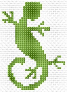 a cross stitch pattern with a green lizard on it's back and the letter s in