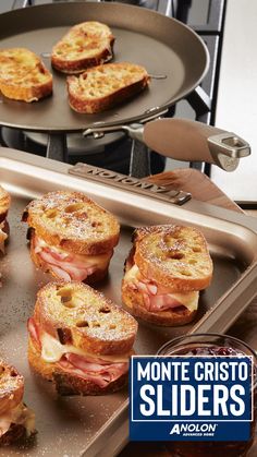 there are many sandwiches on the pans ready to be cooked in the stove top