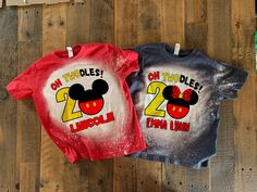 two t - shirts with mickey and minnie mouse on them