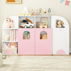 a child's play room with toys and bookshelves on the floor in front of a wall