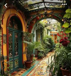 an arched walkway with potted plants on either side