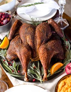 A spatchcocked turkey on a table scape of sides and decorations. Turkey Spatchcock, Smoked Turkey Rub, Traeger Smoked Turkey, Spatchcocked Turkey, Spatchcock Turkey Recipe, Grilled Turkey Recipes, Turkey Smoked, Spatchcock Turkey, Smoked Turkey Wings