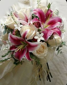 a bridal bouquet with pink and white flowers