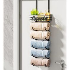 a towel rack with five rolls of towels hanging on it