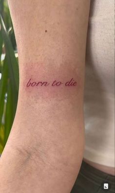 a woman's arm with the words born to die written in cursive font