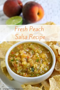 fresh peach salsa recipe in a white bowl with tortilla chips on the side