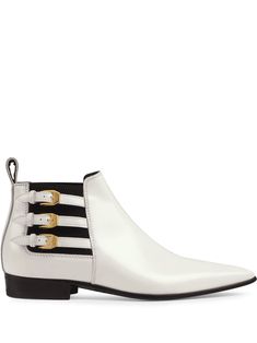 Nothing like a brand new pair of boots to make you feel like you can conquer the world. These white leather pointed side buckle ankle boots from Gucci were made for walking, strolling, dancing - you name it. Everyone else will be shaking in their (non-Gucci) boots when they see you in these. Featuring a pointed toe, a gold-tone buckle fastening, elasticated side panels, a pull tab at the rear and stitching details. Gucci Boots, Conquer The World, Buckle Ankle Boots, Stitching Details, Gucci Leather, Buckle Boots, Pointed Toe Shoes, Gucci Shoes, Shoes Booties