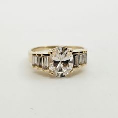 Vintage 14k Yellow Gold Cubic Zirconia Cocktail Ring, Size 8.5 Item w#189 Clean and in good condition Marked 14k 3.9 grams Oval and Baguette Cut Cubic Zirconia Size 8.5 Welcome to Westgate Jewels!! We specialize in vintage estate, designer, and fine jewelry. Our shop consists of items that are estate, antique, and / or vintage conditions unless otherwise noted. This means that most items are prior owned and may have some imperfections such as light scratches, scuffs, and / or patina. Our items a April Birthstone Ring, Vintage Native American Jewelry, Vintage Designer Jewelry, Cubic Zirconia Rings, Birthstone Ring, Native American Jewelry, 14kt Gold, Unique Charms, Estate Jewelry