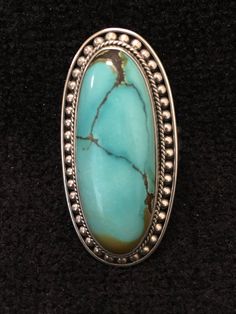 "Ring ~ Artist: Teresa Bradford-Cole Natural Stone Oval Turquoise Heavy Gauge Sterling Silver Be bold in style with this stunning long turquoise stone It features a long oval natural stone Many tribes considered turquoise to be a stone of the sky and wearing items of turquoise jewelry provided protection, good health, and long life. Size: 8 Length: 1 3/4\" Width:3/4 You deserve to know about my fabulous Treasure chest Modern Tribal Jewelry, Statement Piece Jewelry, Art to Wear Jewelry, Fantastic Oval Turquoise Ring With Stones, Antique Turquoise Jewelry, Statement Piece Jewelry, Hippie Rings, Pacific Grove, Beaded Handbag, Turquoise Rings, Bead Leather, Vintage Turquoise