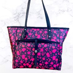 Navy Blue Leather Coach Tote With Pink Flowers. Never Been Used. Smoke Free Pet Free Home. This Nwt Coach City Tote In The Prairie Calico Floral Print Is A Stylish Addition To Any Woman's Wardrobe. The Bag Features A Black Handle/Strap And A Pink Exterior Color, Making It Perfect For Both City And Casual Use. The Tote Is Made Of Canvas Material And Has A Beautiful Pattern That Will Attract Attention. The Bag Comes With A Pouch And Has Black Lining Inside. It Is A Perfect Fit For Women Who Love T Pink Coach Pouch Bag, Coach Pink Pouch Shoulder Bag, Pink Bag With Zipper Pocket For On-the-go, On-the-go Pink Bag With Zipper Pocket, Pink Pouch Bag With Zipper Pocket, Pink On-the-go Bag With Zipper Pocket, Pink Coach Bag With Zipper Closure, Pink Satchel Bag With Zipper Pocket, Pink Coach Shoulder Bag For Daily Use