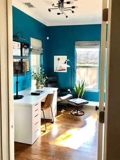 a room with blue walls and wooden floors