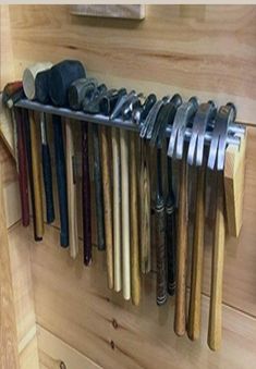 there are many different tools hanging on the wall