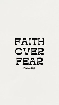 a black and white photo with the words faith over fear