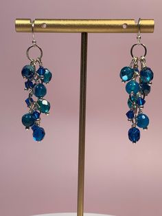 Beautiful deep teal cluster beaded earrings that measure approximately 2 inches in length. Silver toned ear wires. Handmade Wire Jewelry, Handmade Wire, Deep Teal, Beads Jewelry, Spacer Beads, Wire Jewelry, Ear Wires, It Girl, Beaded Earrings