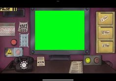 a computer monitor with a green screen sitting on top of a desk next to a phone