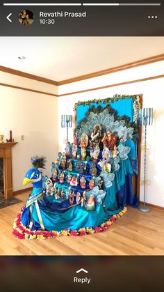 a peacock statue sitting on top of a wooden floor