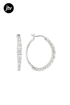 Bella Luce �� white diamond simulant 4.00ctw round, rhodium over sterling silver hoop earrings. Measure approximately 1.13"L x 0.13"W and have saddleback backings. The diamond equivalent weight is 2.28ctw. Oval Cubic Zirconia Hoop Earrings With Diamond Cut, Oval Cubic Zirconia Hoop Earrings Fine Jewelry, White Brilliant Cut Sterling Silver Hoop Earrings, Hypoallergenic Diamond White Cubic Zirconia Hoop Earrings, Hypoallergenic Cubic Zirconia Round Cut Hoop Earrings, White Hoop Jewelry With Channel Set, White Channel Set Hoop Jewelry, White Cubic Zirconia Hypoallergenic Hoop Earrings, White Hypoallergenic Cubic Zirconia Hoop Earrings