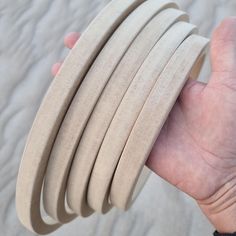 a person holding several pieces of wood in their hand