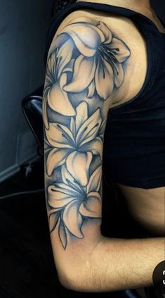 a woman's arm with flowers on it