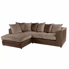 a brown sectional couch with pillows on it