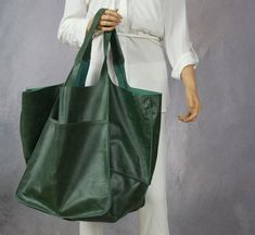 "Very large tote bag-  green shopper bag . Beautiful, hand-made handbag for mother, wife or girlfriend, made of natural, aged leather. Not only is this bag stylish, it can also be used as a diaper bag, daily outings or weekend getaways. This oversized bag has been carefully designed to be the perfect everyday bag. The size makes it practical for carrying everyday essentials. Made from 100 percent Italian leather. This bag is available in different colors, check in my store.  This handbag is made of distressed leather. This can lead to variations in color and shading. This adds individuality to your leather bag. * Includes two large internal pockets for mobile phone and other small items. * Top closure magnet for security. Height: 39 cm / 15.3\" Height from top of handle to base: 68 cm / 26 Green Large Capacity Tote Hobo Bag, Large Capacity Green Tote Hobo Bag, Green Tote Weekender Bag For On-the-go, Green Large Capacity Hobo Bag For Everyday, Everyday Large Capacity Green Hobo Bag, Dark Green Tote Bag For Travel, Dark Green Shopping Tote Bag, Green Tote Weekender Bag, Green Weekender Bag With Large Capacity For Daily Use