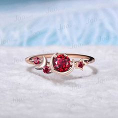 DETAILS: - Material : 925 Sterling Silver (Hypoallergenic, Nickel Free, Tarnish Resistant) 10/14/18k white/rose/yellow gold...), platinum - Main stone : 5mm round lab created ruby - Accent Stone : lab created ruby - Stone Cut : round AFTER-SALE SERVICE : 30 days money-back guarantee and for any reason, you are not satisfied with your purchase, please contact me and I will quickly handle your request within 24 hours. ACCEPT CUSTOM SERVICE: 1. Accept change main stone type 2. Accept change other material : This jewelry can also be made in solid gold (including 10/14/18k white/rose/yellow gold...), platinum Please contact me if you have special requests. Thanks for your visiting! Asymmetrical Ring, Celestial Ring, Star Cluster, Gold Moon, Ring Rose Gold, Ruby Stone, Ruby Jewelry, July Birthstone, Delicate Jewelry