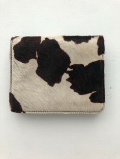 Black And White Pony Hair Cowhide Leather Belt Bag with magnetic closure Never used. Perfect condition. Attaches to any belt. Super stylish. Paid $175.00 Designer Square Wallets For Everyday, Designer Square Wallets, Casual Brown Bags With Card Slots, Luxury Square Wallet For Everyday Use, Beige Leather Bag With Card Slots, Trendy Beige Leather Wallet, Luxury Square Wallets As Gift, Luxury Square Wallets For Gift, Luxury Square Wallet As Gift