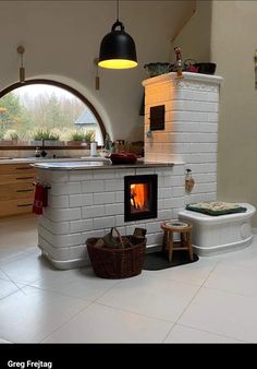 a white brick oven sitting inside of a kitchen