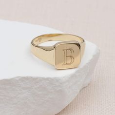 PRODUCT DESCRIPTION * Our Personalised Ladies' 9ct Yellow Gold Plain Square Signet Ring is crafted from solid 9ct gold. This chunky square signet ring offers timeless elegance for everyday wear. * Personalise this gold ring with your initials or the lucky recipient's initials, making it a bespoke keepsake and a stylish addition to your jewellery collection. *This ladies' signet ring combines classic design with modern personalisation. Whether it's a treat for yourself or a thoughtful gift, this Everyday Yellow Gold Signet Ring With Initials, Classic Engraved Rectangular Initial Ring, Classic Rectangular Signet Ring Stamped 14k, Classic 14k Gold Rectangular Initial Ring, Classic Rectangular Rings With Initials, Classic Rectangular Signet Ring With Initials, Anniversary Initial Ring With Rectangular Shape, Classic Yellow Gold Rectangular Initial Ring, Classic Rectangular Yellow Gold Initial Ring