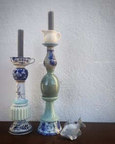 three vases sitting on top of a wooden table